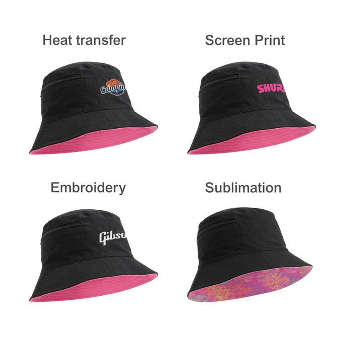 A black bucket hat with a pink underside and various promotional logos in different print styles.