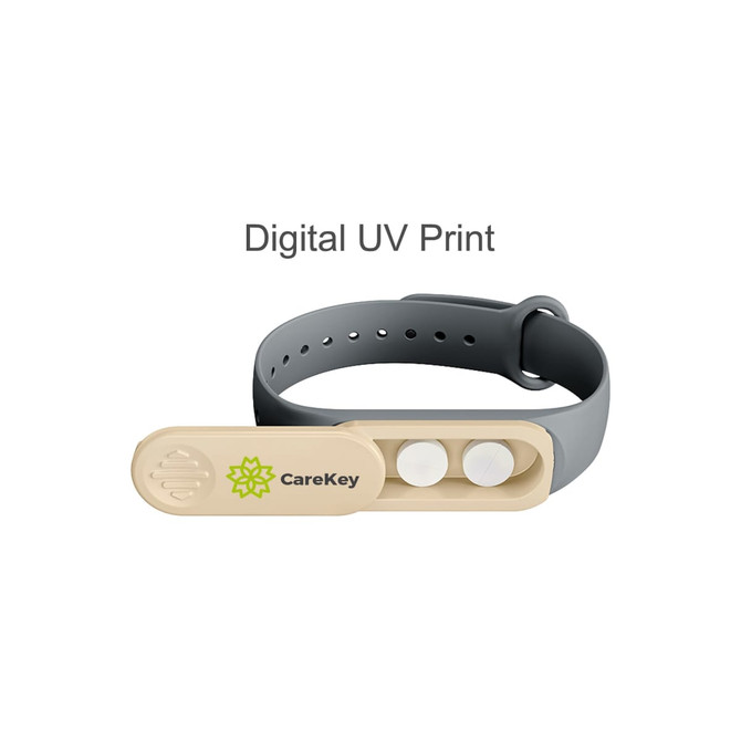 A wristband in grey and beige with a logo and two buttons on the clasp.