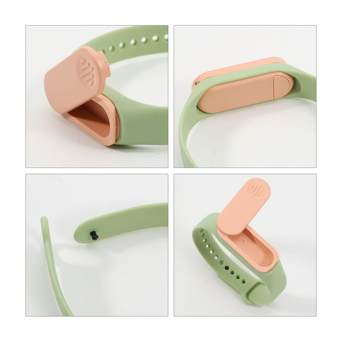 A green and peach wristband with a removable compartment for storing medicine. Features a logo.