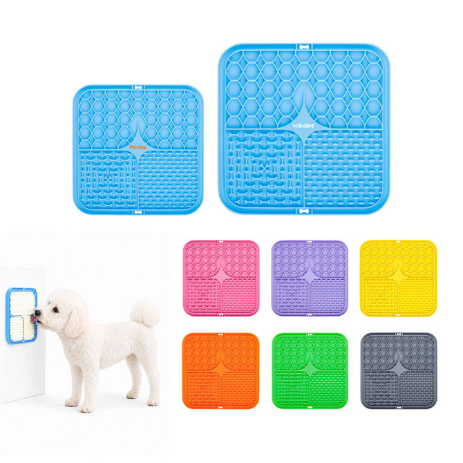A blue, square dog enrichment lick mat with three textured sections, surrounded by colourful mats in pink, purple, yellow, and grey.
