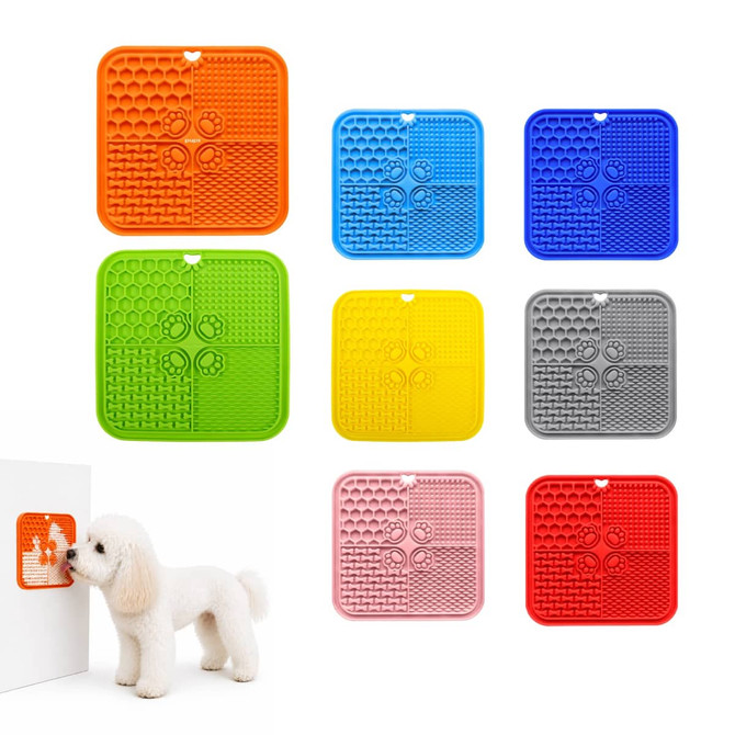 A collection of four-section dog enrichment lick mats in orange, blue, yellow, grey, red, and pink. Each mat features various textured sections and has a logo.