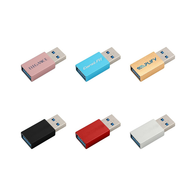 A collection of six USB data blockers in pink, blue, black, red, white, and gold, featuring various branding.