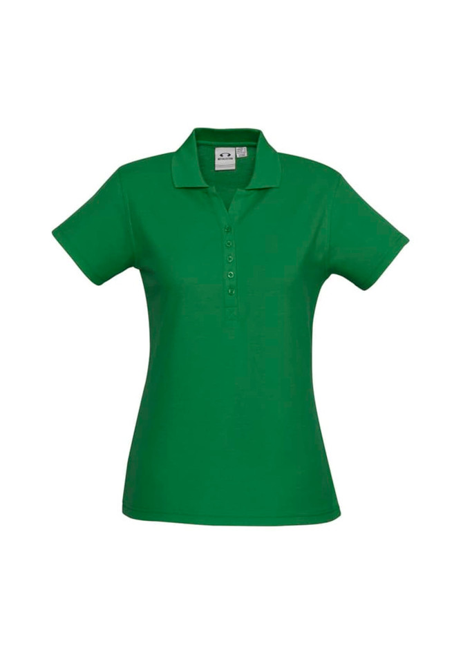A green ladies' polo shirt featuring a collar and button placket, with a branding logo on the side.