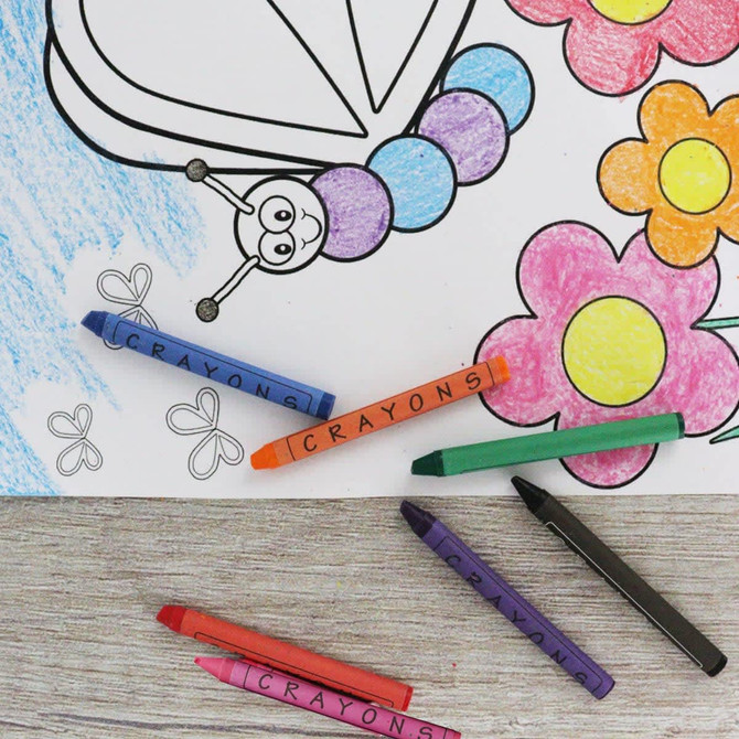 A set of brightly coloured crayons, including purple, orange, green, blue, red, and black, arranged near a colouring page.