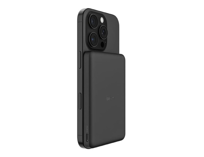 A slim black magnetic power bank attached to the back of a smartphone, featuring multiple camera lenses.