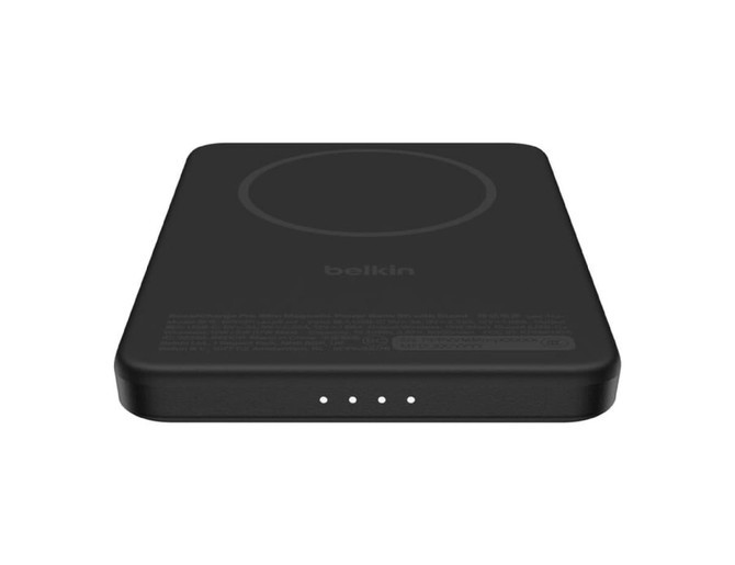 A black slim magnetic power bank featuring a circular charging area and three indicator lights. It has a logo.