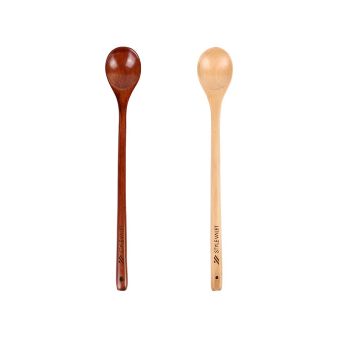 Two long handle wooden spoons in different shades, one dark brown and the other light yellow, with branding on the handles.