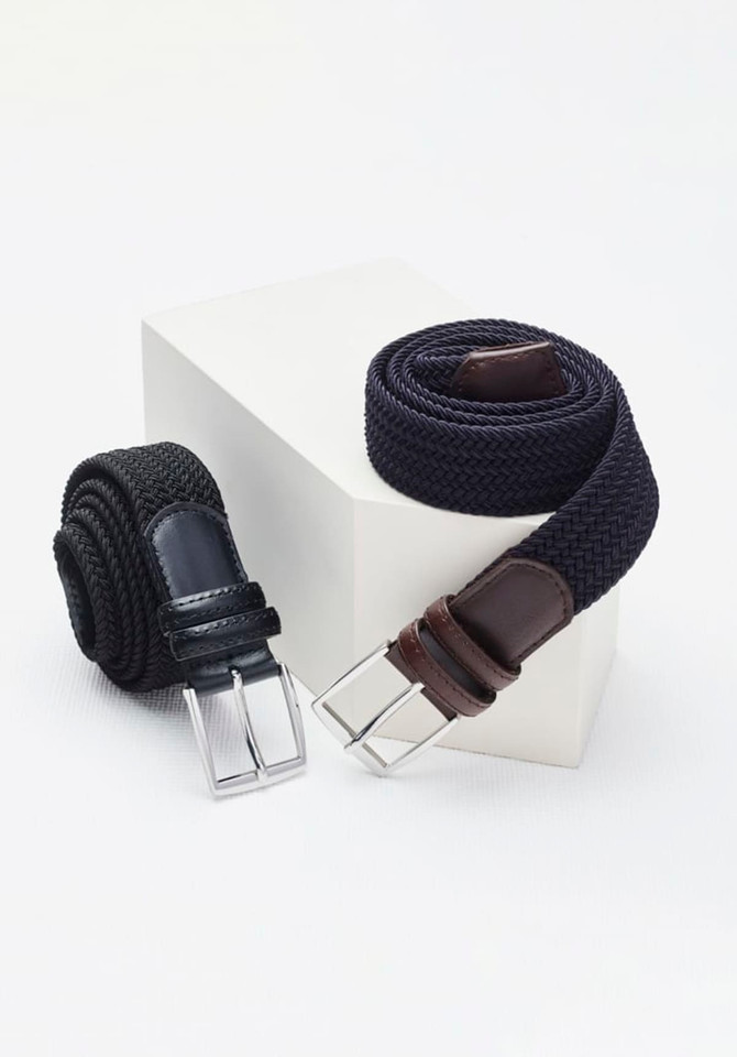 A dark blue braided belt and a black woven belt both featuring silver buckles, displayed on a white pedestal.