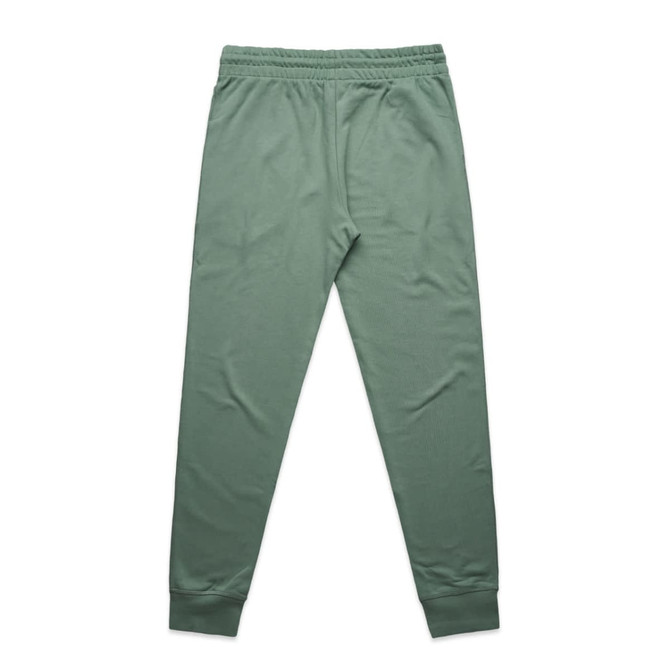 A pair of premium track pants in a soft green shade with an elastic waistband and cuffs. Features a logo.