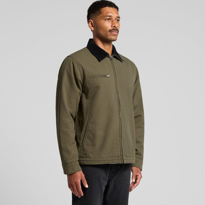 A man wearing an olive green Canvas Cord Collar Jacket with a black collar, featuring a zipped pocket.