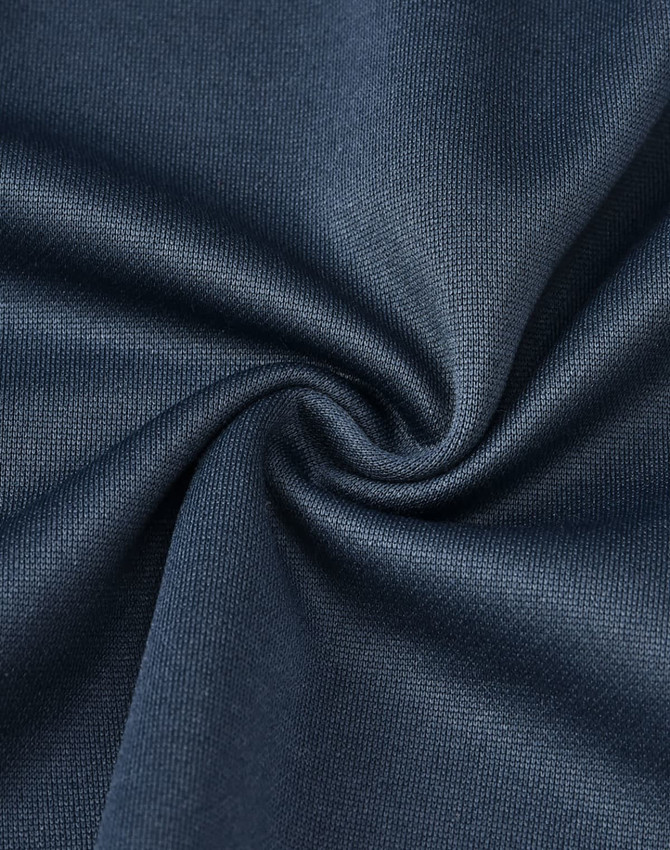 A close-up of dark navy fabric, showcasing a smooth, textured surface suitable for polo shirts.