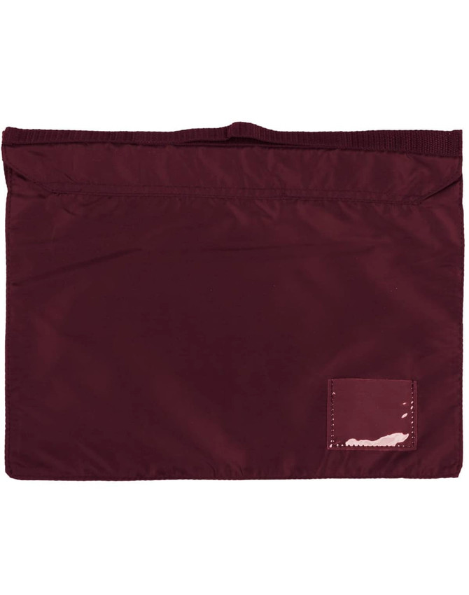 A maroon satchel with a textured surface and a small patch. It has a top opening and no visible logos.