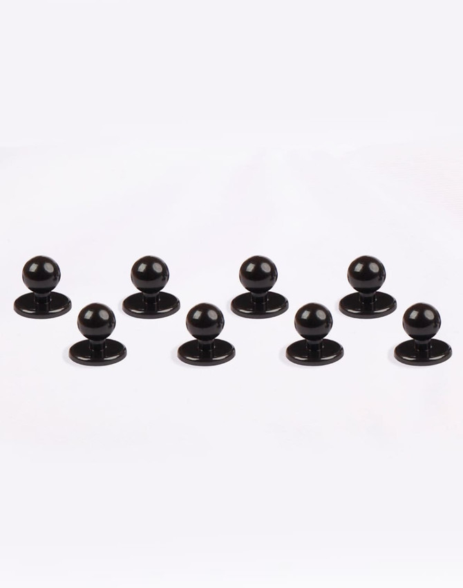 Eight black exchangeable buttons for chef wear displayed on a white background. Features round tops and flat bases.