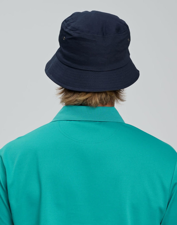 A navy bucket hat with a contrasting underbrim, shown from the back, paired with a teal shirt.