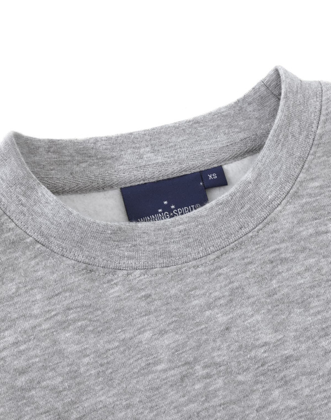 A grey crew fleece jumper with a round neckline and a tag featuring logos.