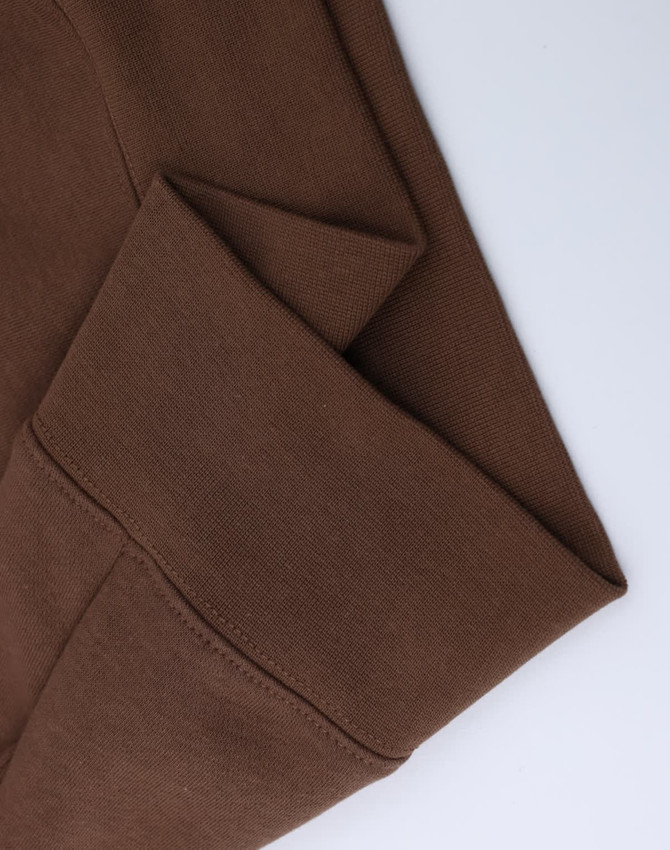 A brown half-zip collar fleece jumper with a soft texture and folded cuffs. Features a branding logo.