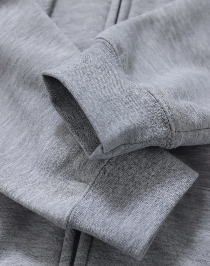 A grey men's full-zip fleecy hoodie with a close-up of the cuffs and fabric texture, featuring a logo.