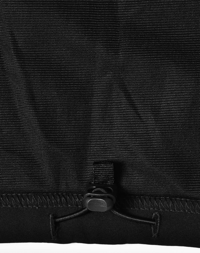 A black softshell vest featuring a drawstring adjustment at the bottom and a logo.