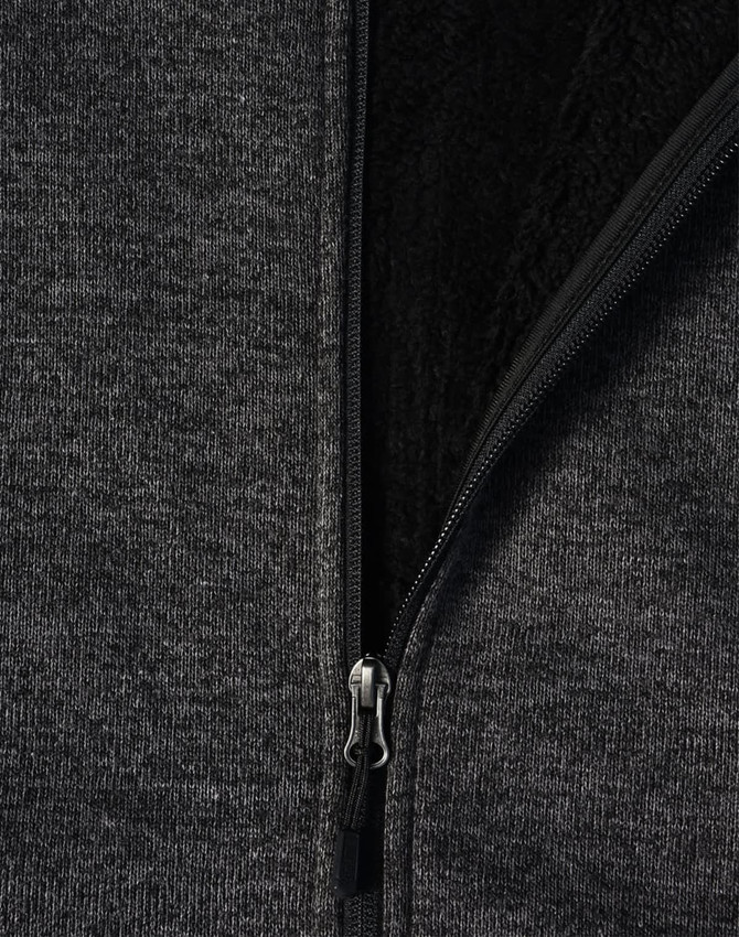 A grey bonded fleece jacket featuring a zippered front and a black interior lining. The jacket includes a logo.