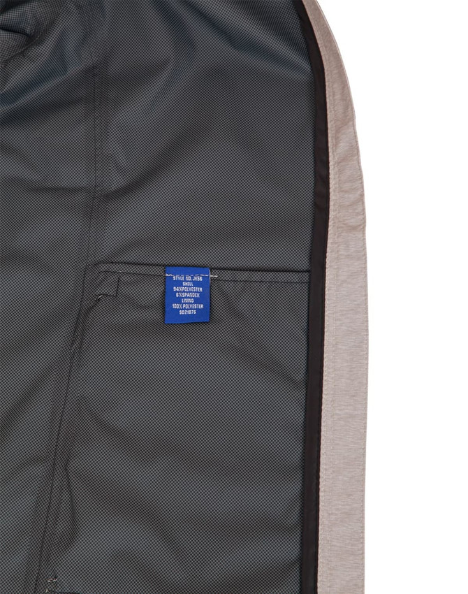A men's waterproof performance jacket in grey with a mesh lining and a visible interior label.