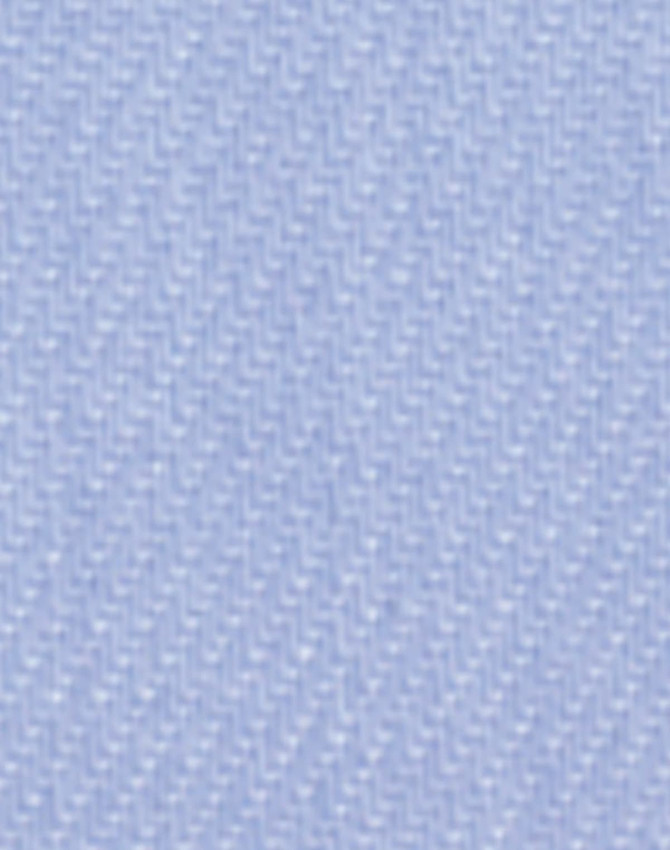 A close-up of light blue fine twill fabric, featuring a textured woven pattern, suitable for button-up shirts.