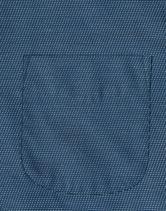 A close-up of a blue men's button-up shirt featuring a pin dot pattern and a pocket.