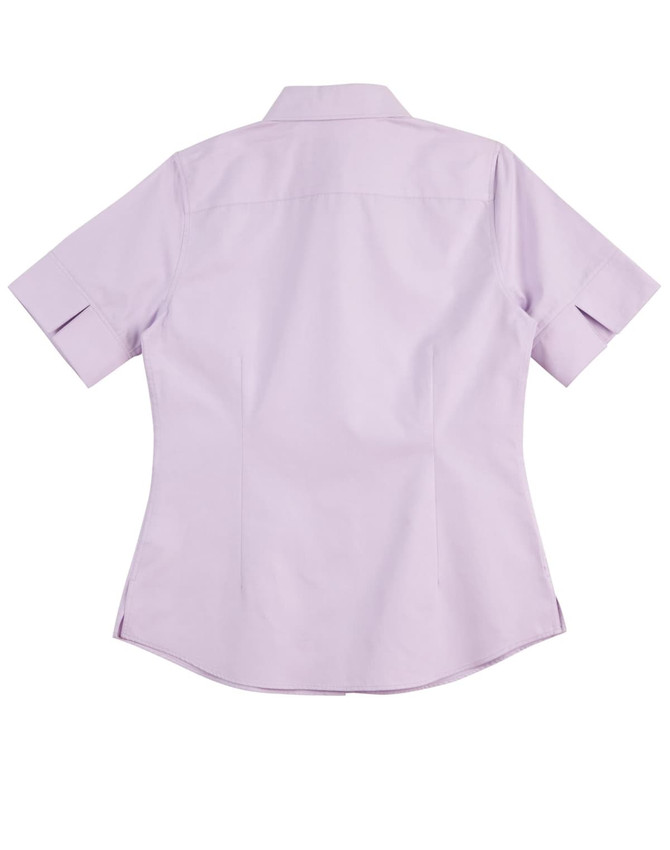 A short-sleeved, button-up women's shirt in light purple with a fitted back design and a logo on the fabric.
