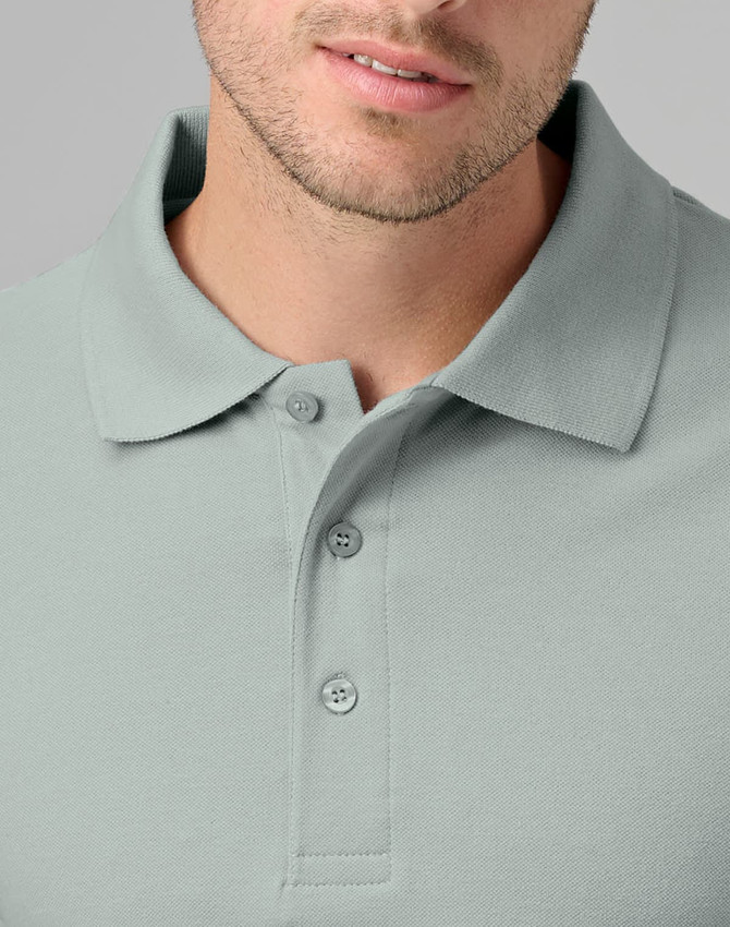 A men's cotton stretch polo in a soft green colour, featuring a collar and three-button placket.