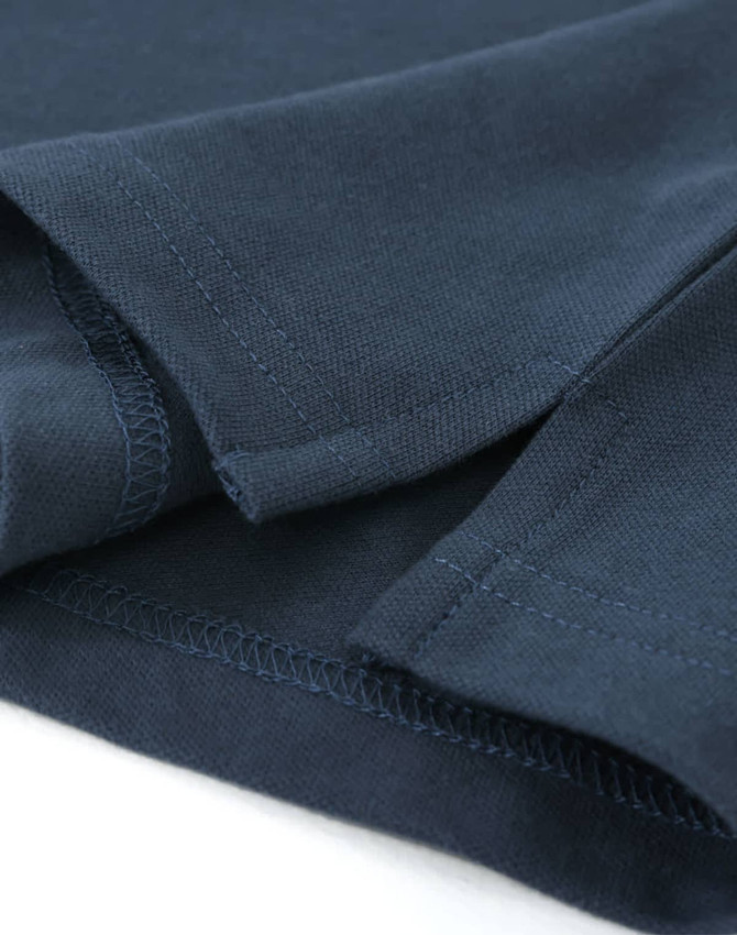 A navy cotton stretch polo shirt with detailed stitching and a subtle logo.