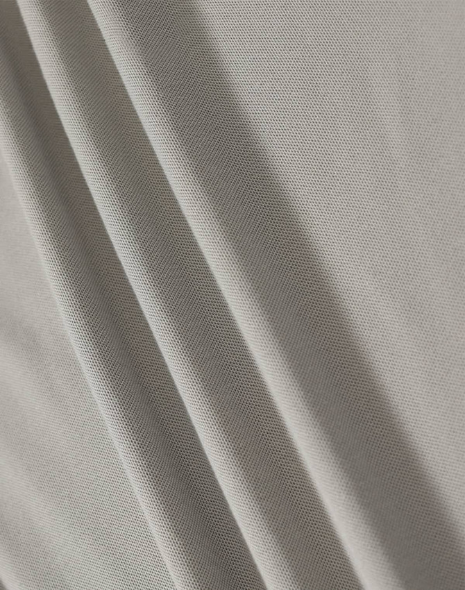 A textured, light grey fabric featuring soft folds. The material is suitable for polo shirts and has a subtle sheen.