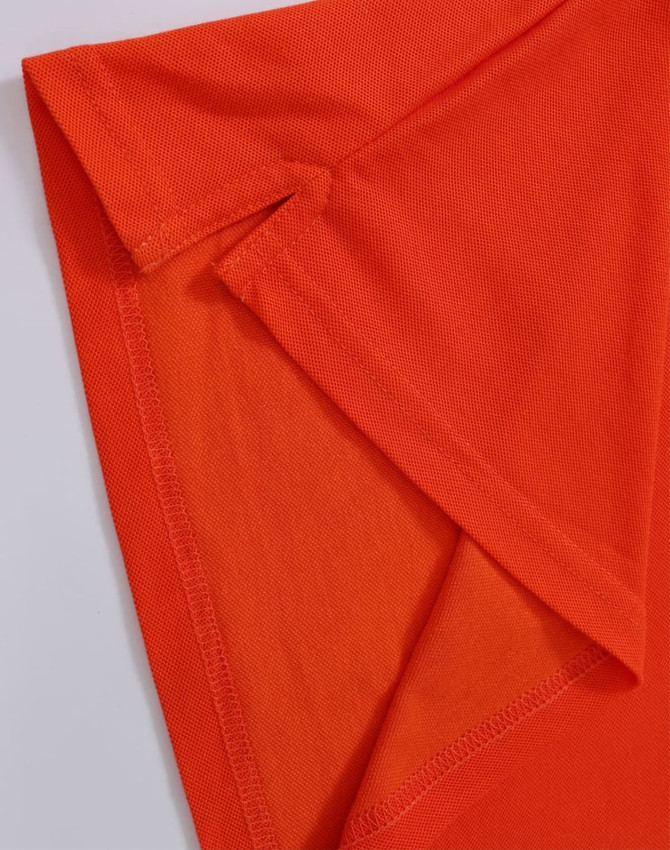 An orange polo shirt featuring a folded sleeve detail and a branding logo.