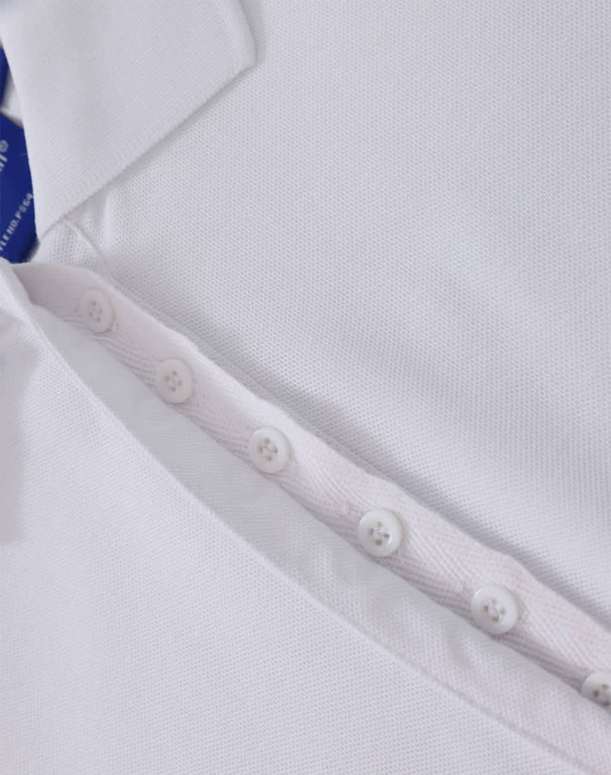 A white polo shirt featuring a button placket and a collar, with a logo present.