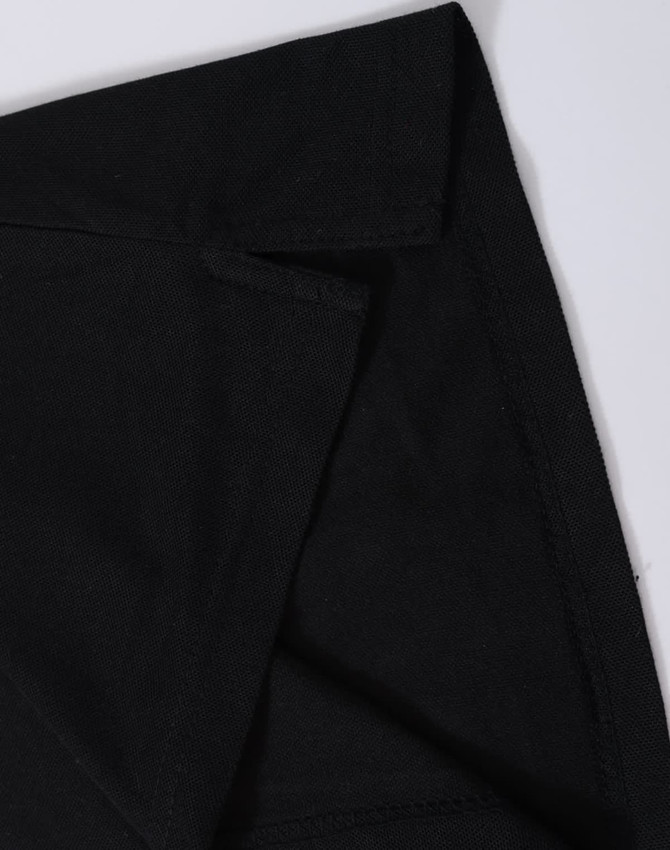 A black polo shirt featuring a classic collar and a logo, highlighting the fabric texture and stitching details.