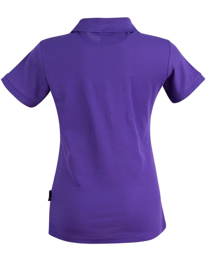 A purple ladies' polo shirt featuring a collared neckline and short sleeves, with a brand logo at the hem.