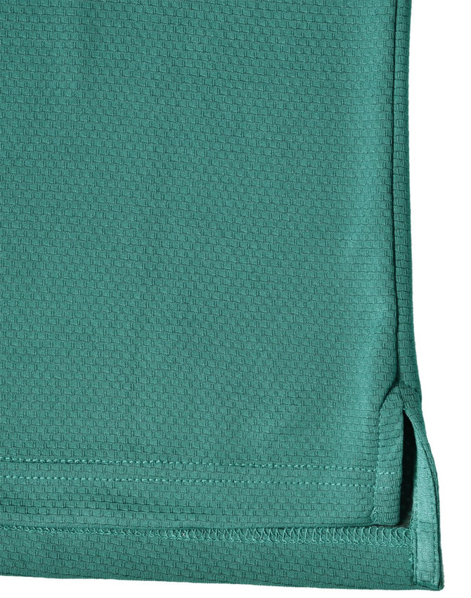 A close-up view of a teal men's bamboo charcoal polo shirt, featuring a hem with side splits and a logo.