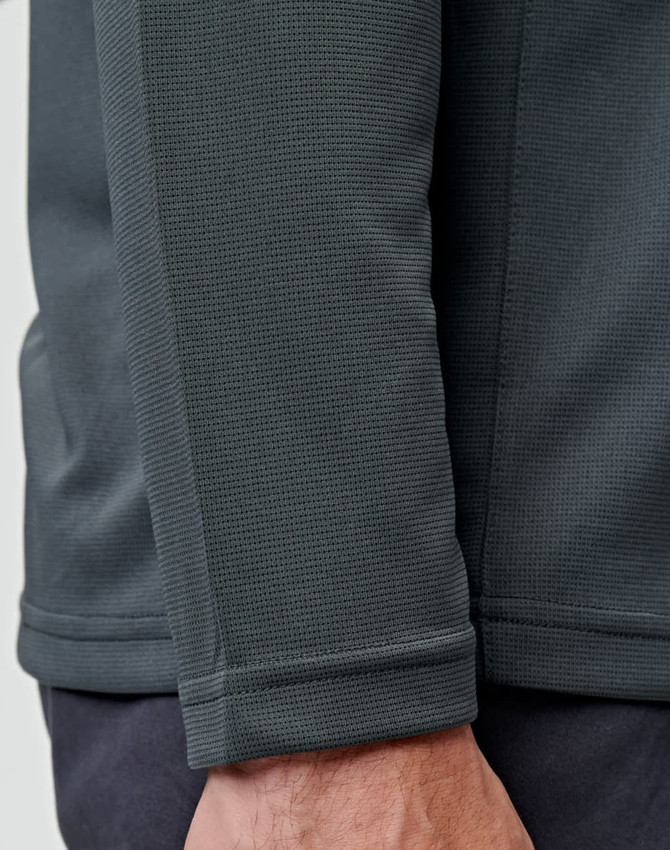A close-up of a men's long sleeve polo shirt in dark grey, featuring a textured fabric and a logo.