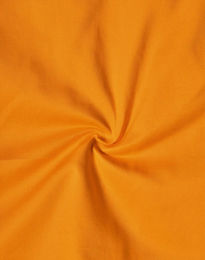 An orange fabric featuring a smooth texture, suitable for safety work shirts. It has a circular twist pattern.