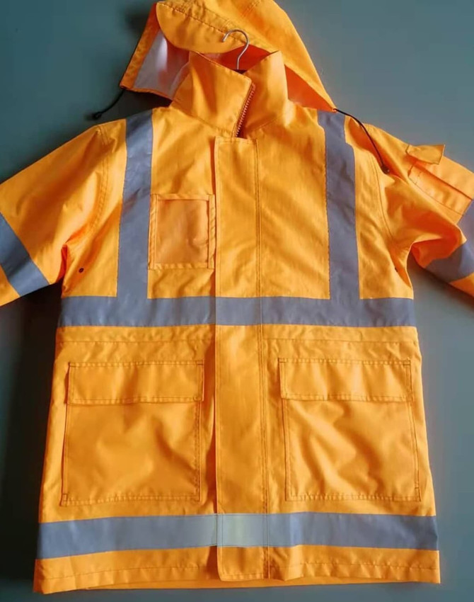 A high-visibility yellow safety jacket featuring reflective strips and a hood, with multiple pockets.