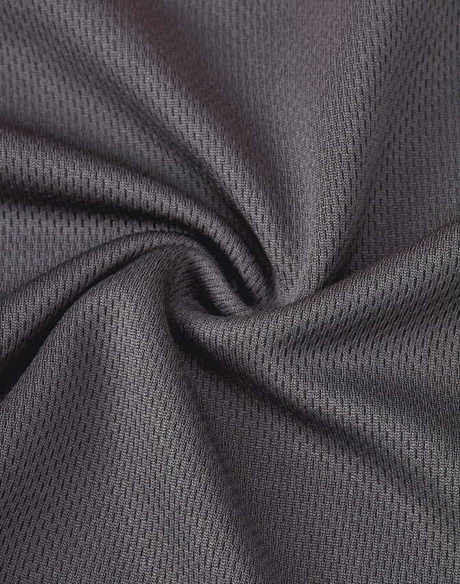 A black, textured fabric showcasing a breathable mesh pattern, suitable for work polo shirts. Includes a logo.