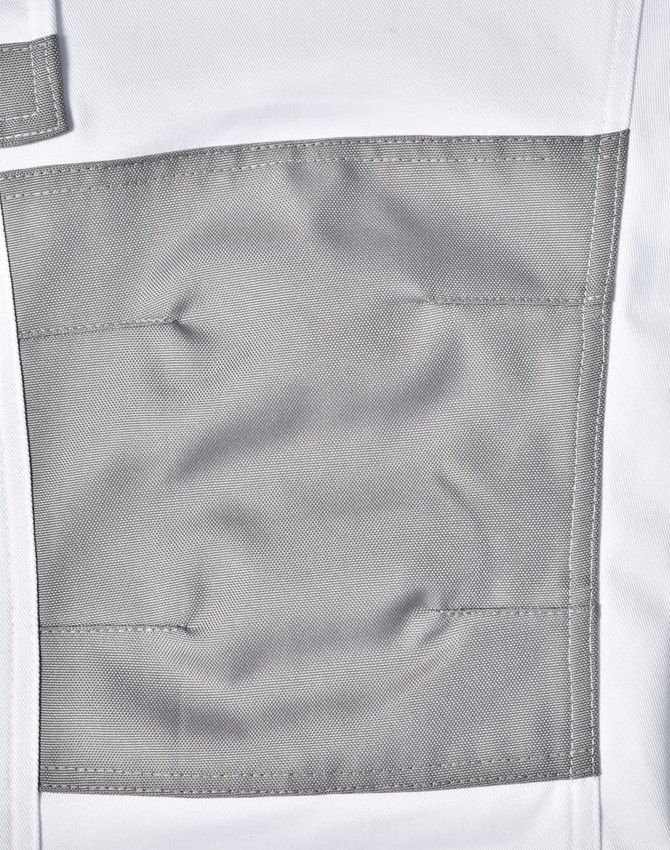 A close-up of unisex utility stretch cargo work pants in white with a grey patch pocket. The pants have a logo detail.