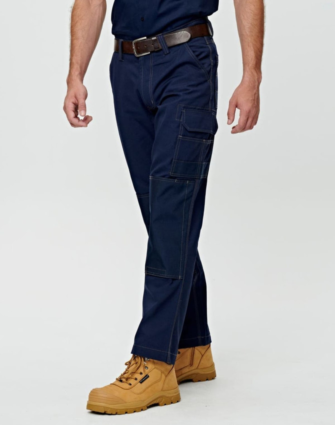Lightweight semi-fitted work pants in navy blue with pockets, paired with tan work boots and a brown belt.