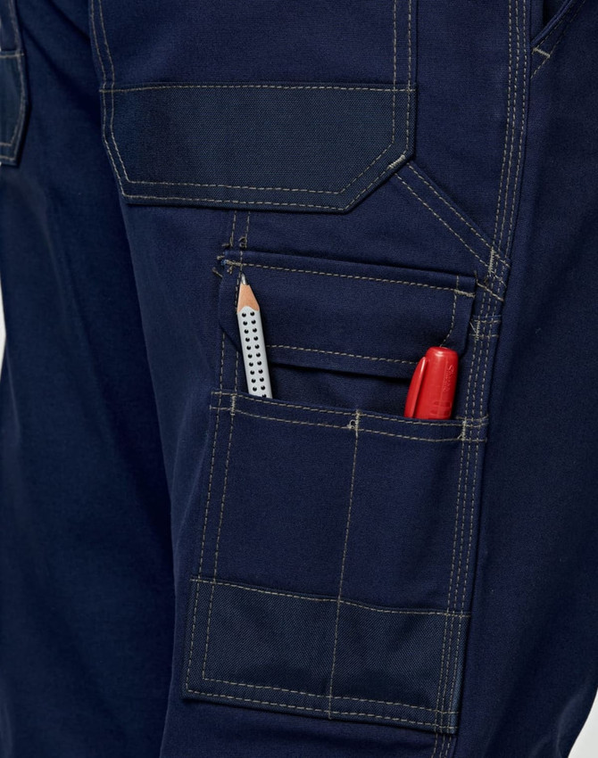 Light weight semi-fitted Cordura work pants in navy, featuring pockets with a pencil and marker visible. Includes a logo.