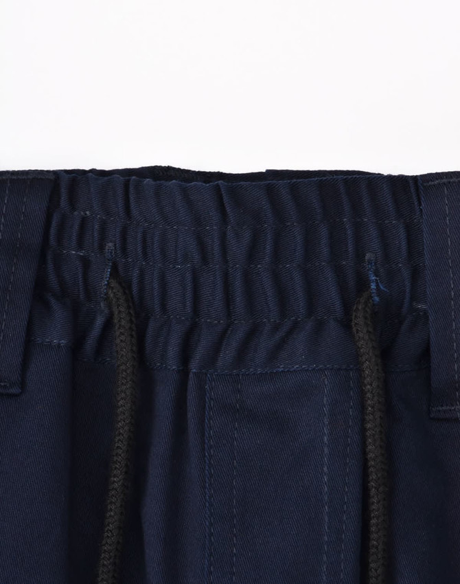 A close-up of navy blue unisex work shorts, featuring an elastic waistband and drawstring with pockets.