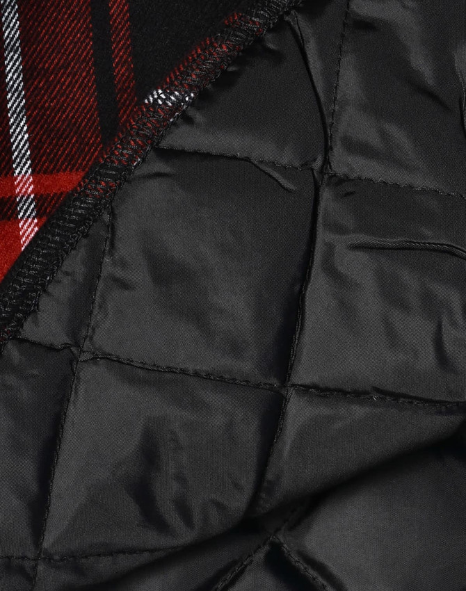 A black quilted flannel shirt with a red and black checkered pattern inside and a logo present.