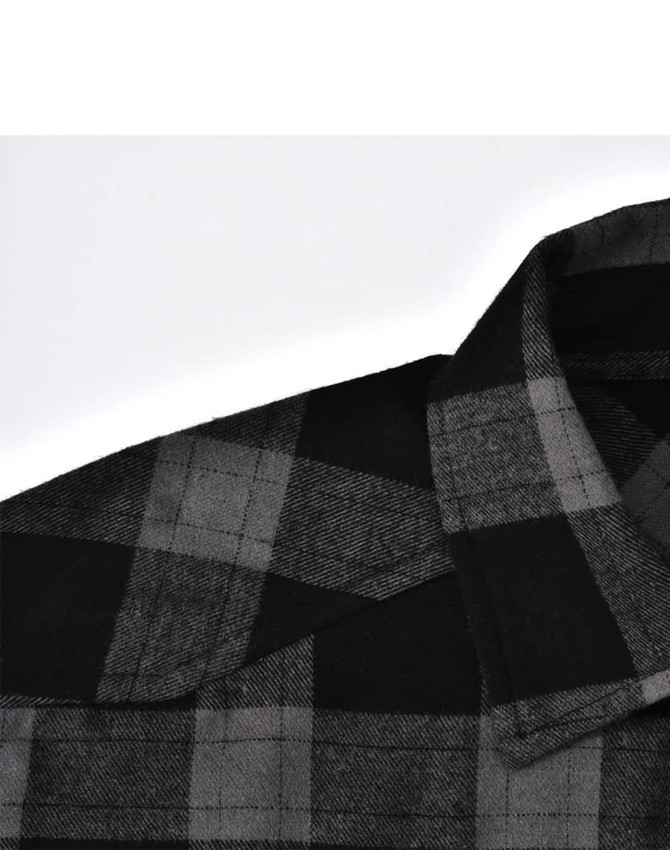 A black and grey plaid flannel shirt with a collar and button-up design, featuring a logo.
