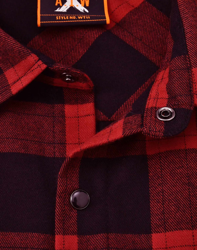 A unisex flannel plaid shirt in red and navy, featuring button details and a collar. It includes a logo tag.