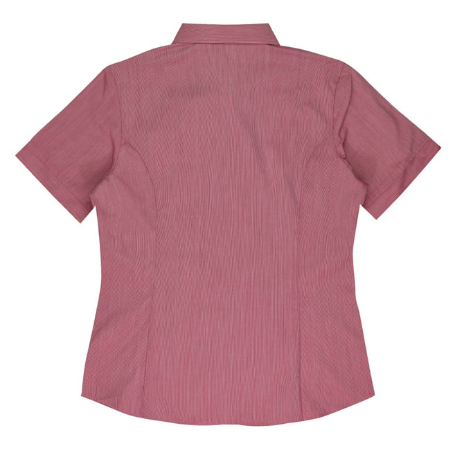 A short-sleeve button-up shirt in a light pink hue, featuring a back yoke and shaping seams. It has a logo.