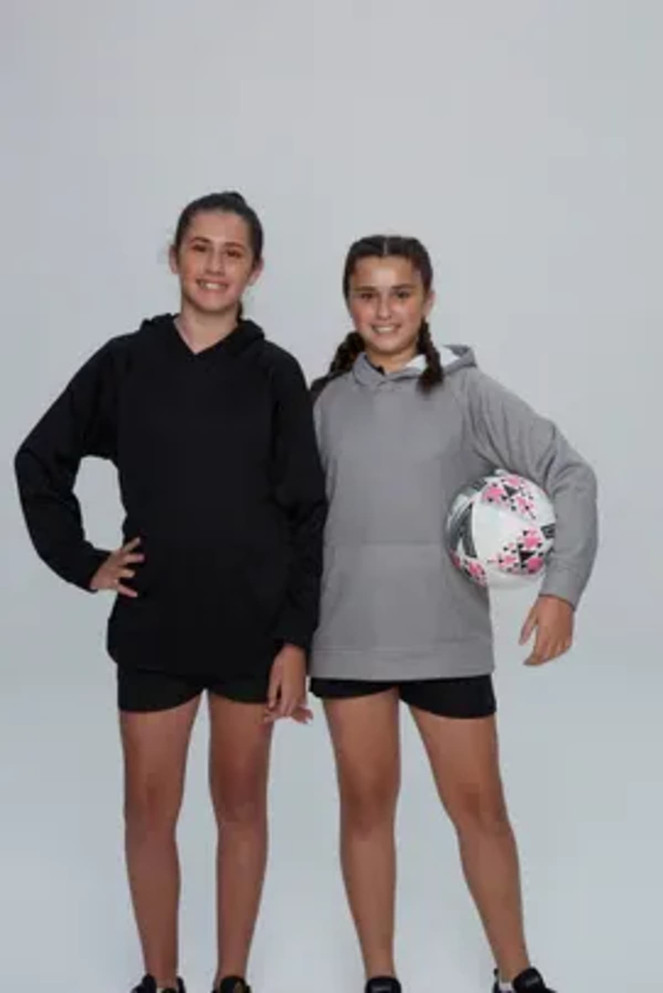 Two girls wearing hoodies, one in black and the other in grey, holding a soccer ball, standing together.