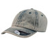 A beige denim dad hat with a curved brim and a logo on the side. The fabric has a faded appearance.