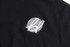 A black turtleneck sweater made from 100% cotton, featuring a simple logo on the fabric.